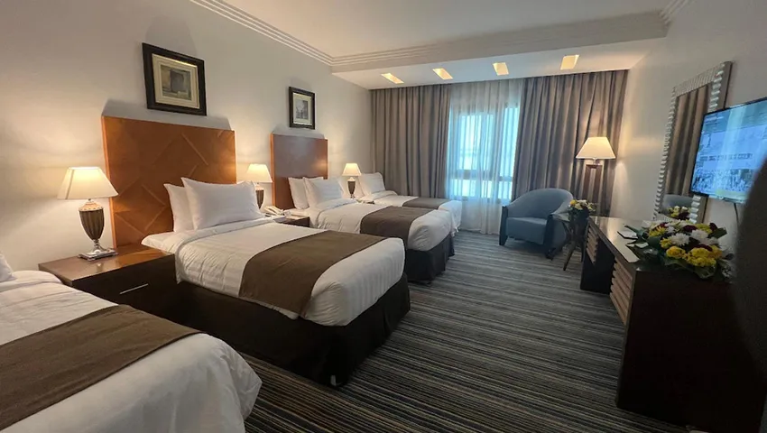 room with 4 single beds